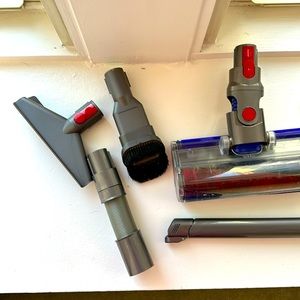 Variety of dyson v8 vacuum attachments. Need cleaned but work great